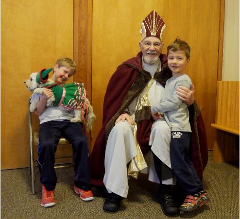 Louis Violette, Christopher Carlson, and Happy enjoy a visit with Saint Nicholas